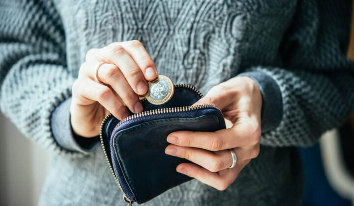 Person with mental health condition looks at their money