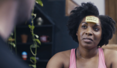 Woman with post-it note on head describing mental health symptom low self esteem