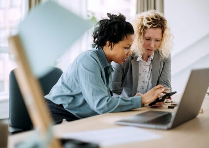 Two teacher businesswoman working together in office