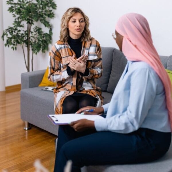 Two people talking in therapy