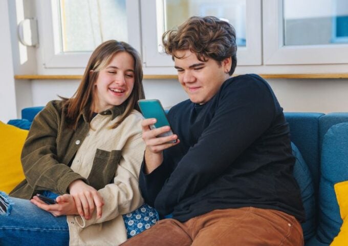 Two young people looking at mobile