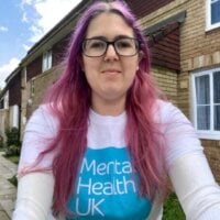 Photo of Melanie wearing an MHUK tshirt