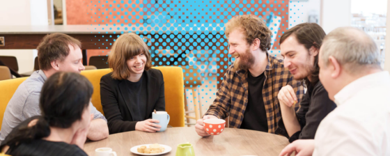 Group of people having a coffee and chatting