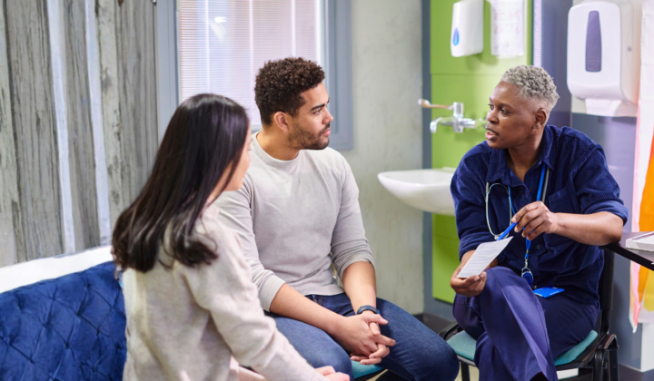 GP talking to a couple